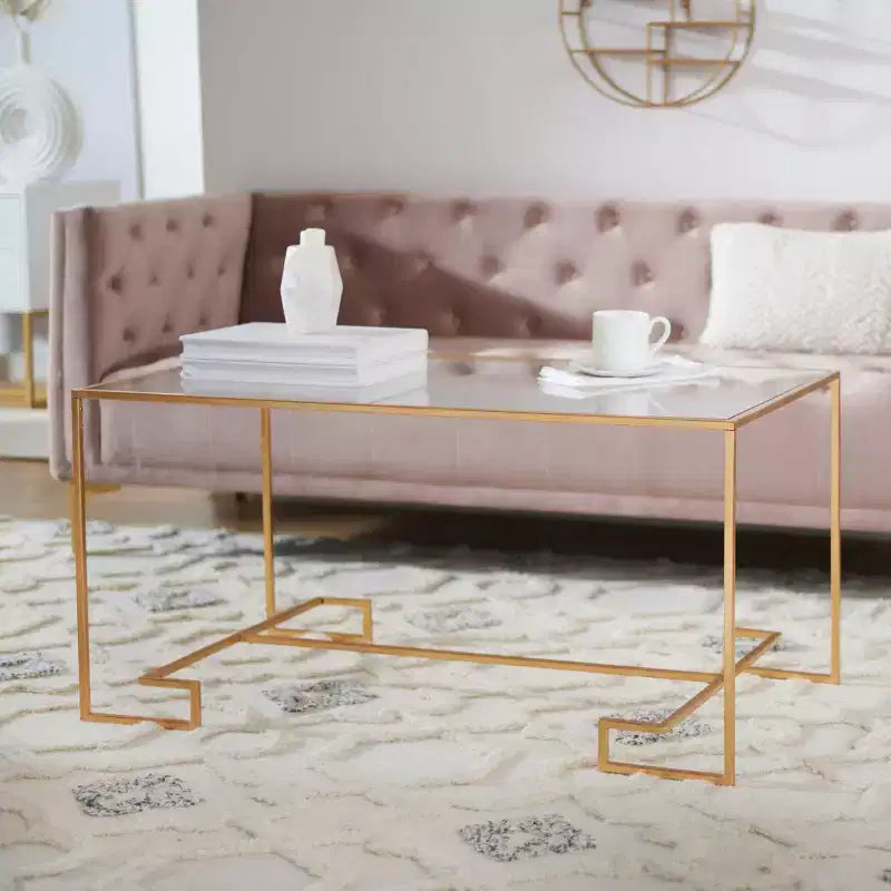 Table basse ronde avec plateau en verre et piètement en X